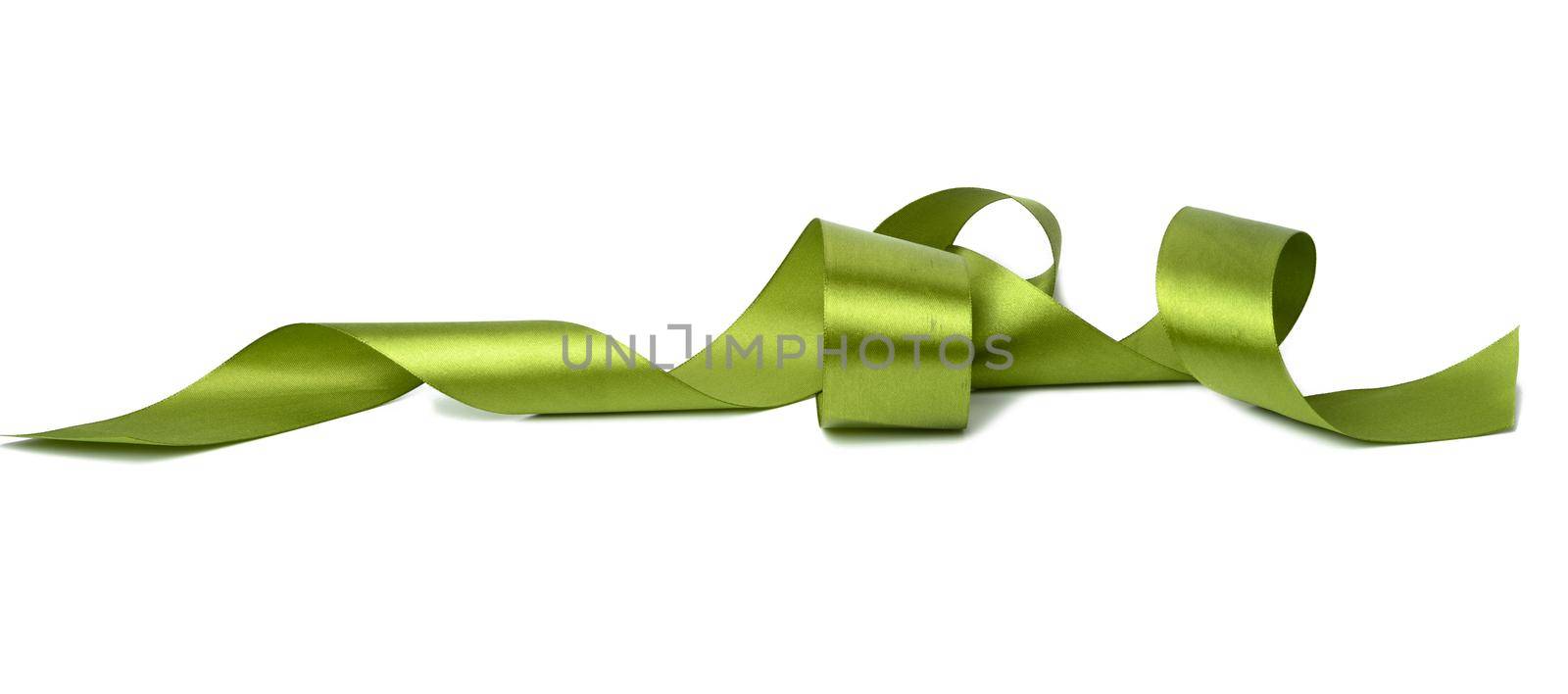 swirling green silk ribbon on white background, gift wrapping decor