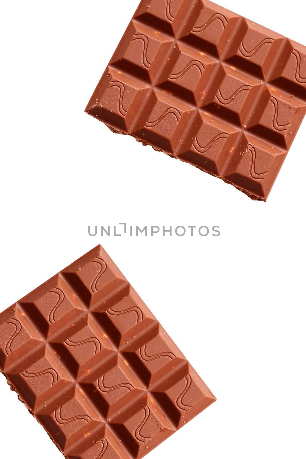 Broken piece of chocolate with crumbs on a white background. Cocoa Dessert
