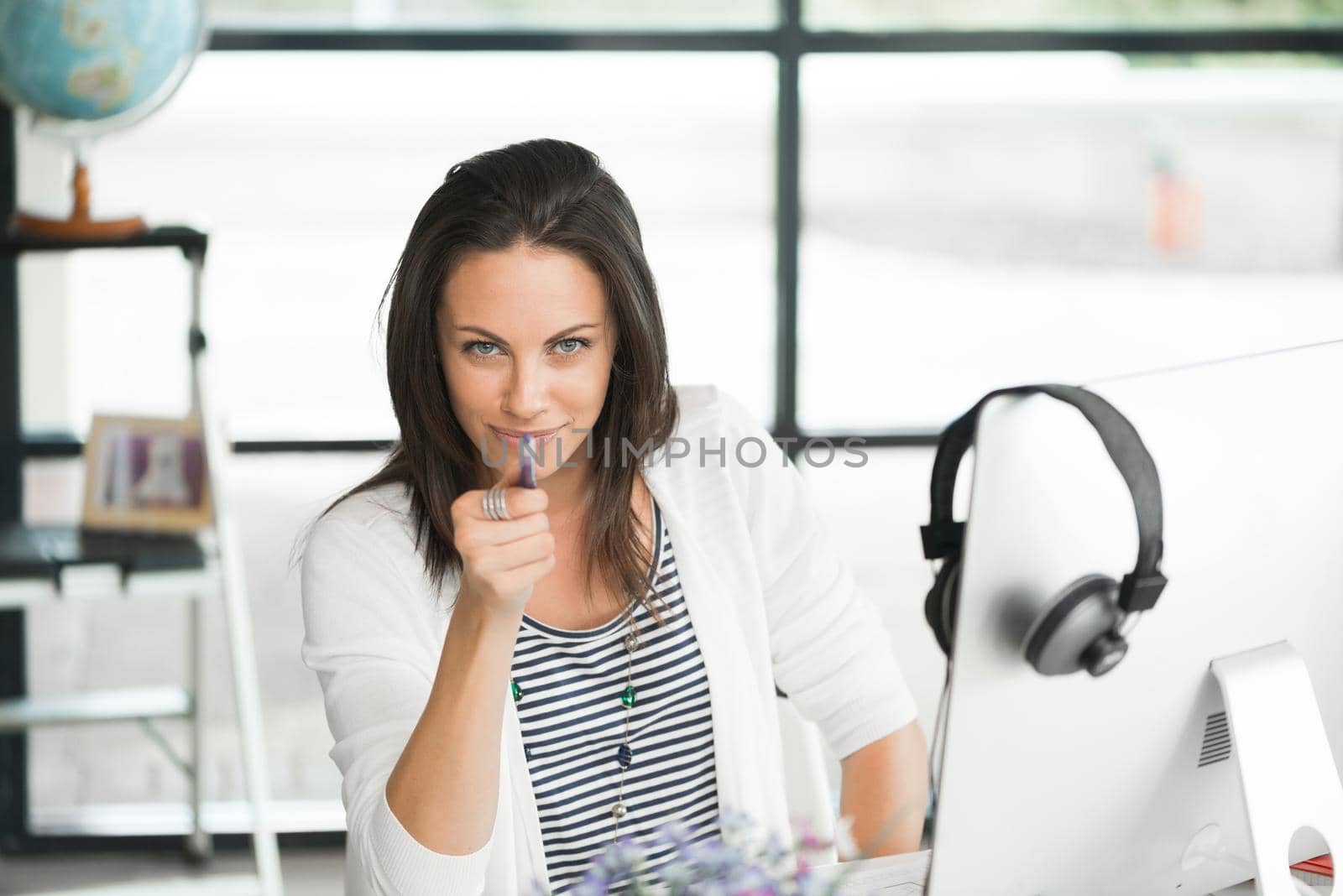 Attractive brunette woman at office desk work on computer