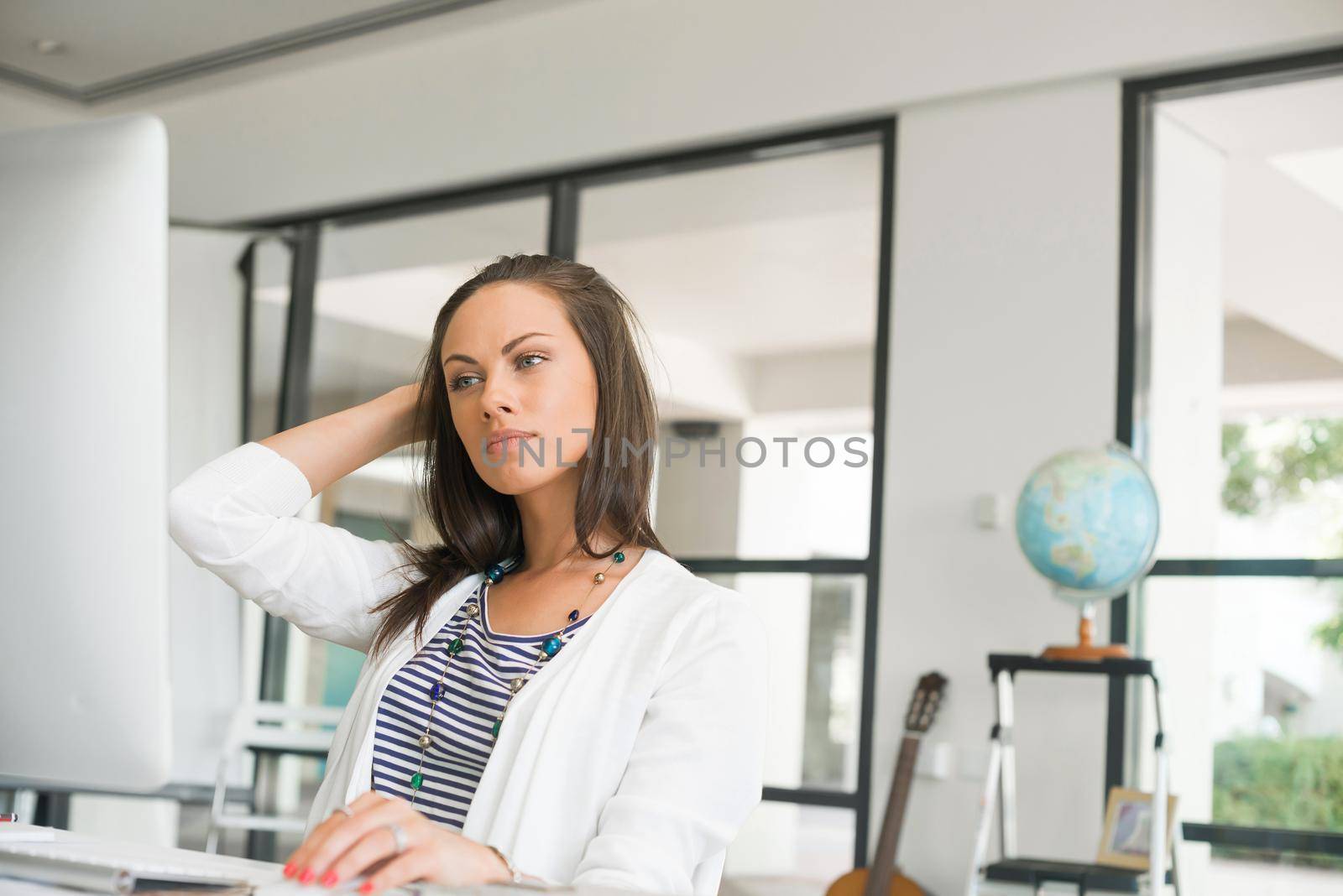 Attractive brunette woman at office desk work on computer