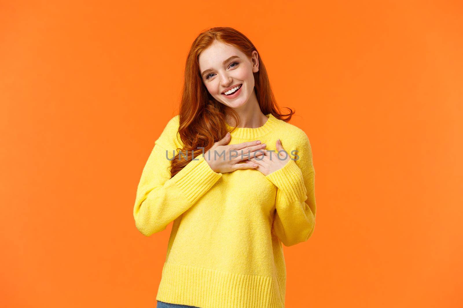 Lovely, tender and feminine redhead woman, girlfriend receive heartwarming gift on valentines day, christmas holiday season, touch heart and sighing romantic, thanking, being grateful by Benzoix