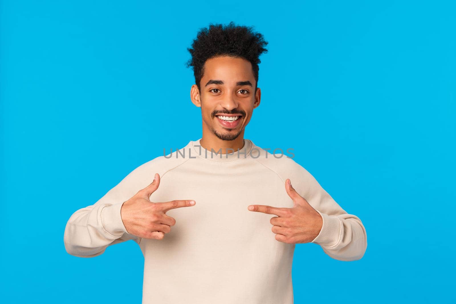 I am the one. Cheerful and friendly confident lucky african american male with hipster afro haircut, pointing himself, want participate, volunteer, bragging or talking boastful personal achievement.