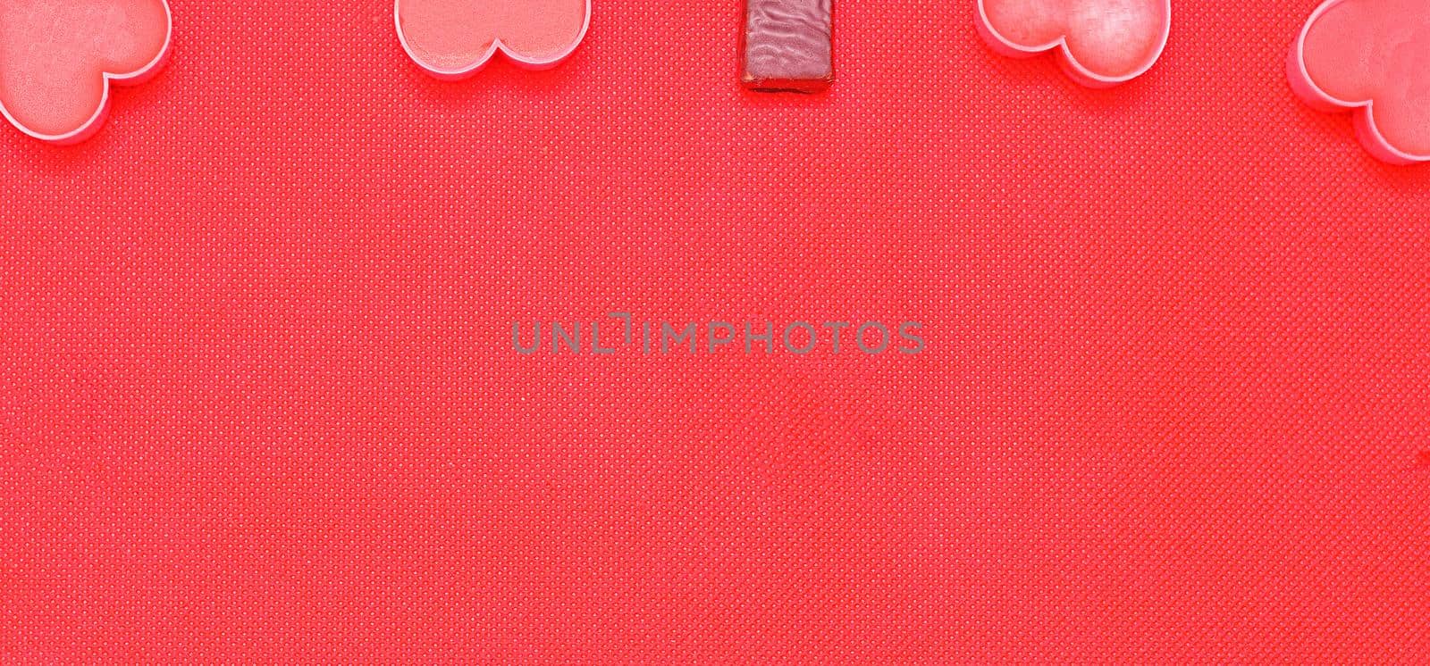 Happy valentines day.Pink romantic hearts and chocolate candies on pink background.Romantic Valentine day background.