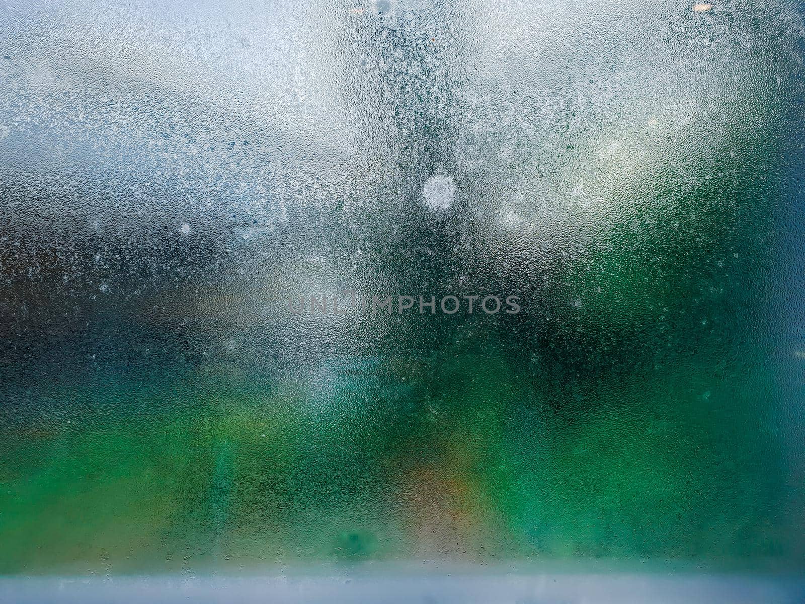 Water drops steam of rain on window glass after the rain