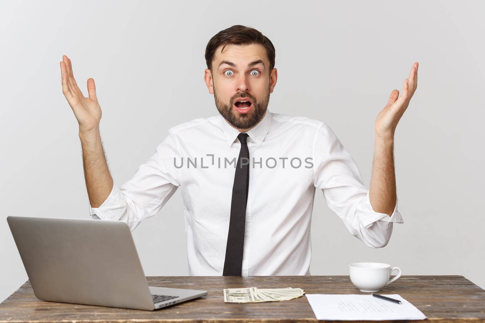 Young businessman in a workplace with surprise and shocked facial expression by Benzoix