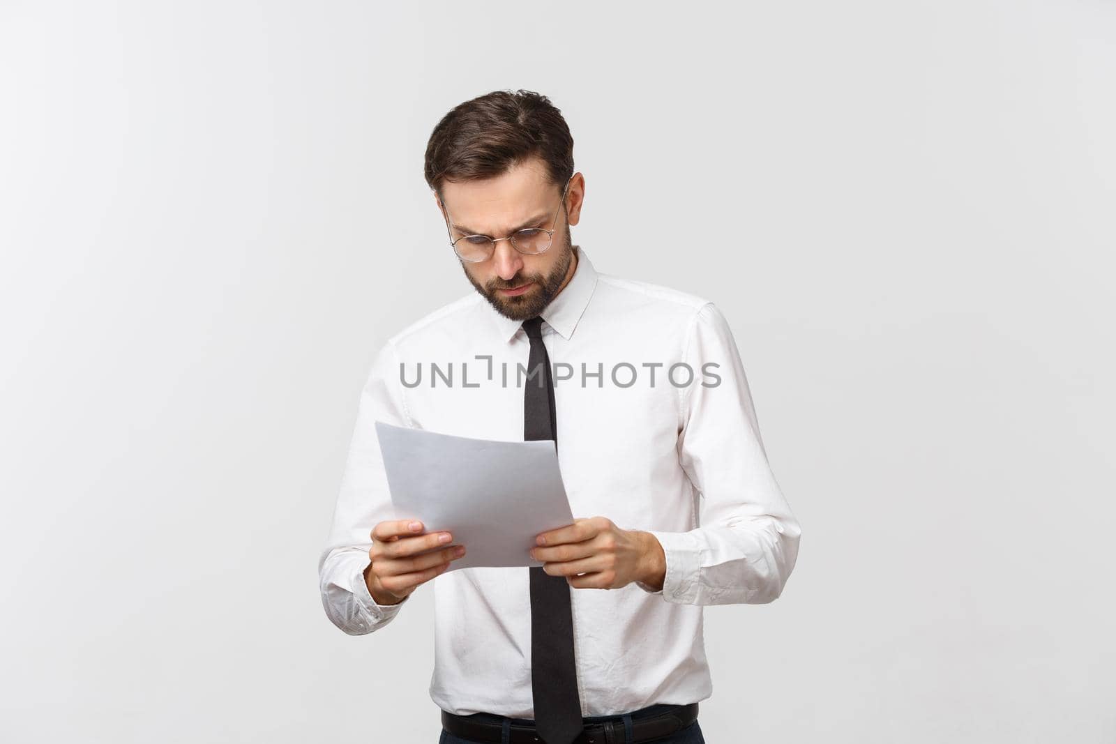 young business man serious writing on clipboard, Handsome businessman wear elegant suit and tie isolated over white background