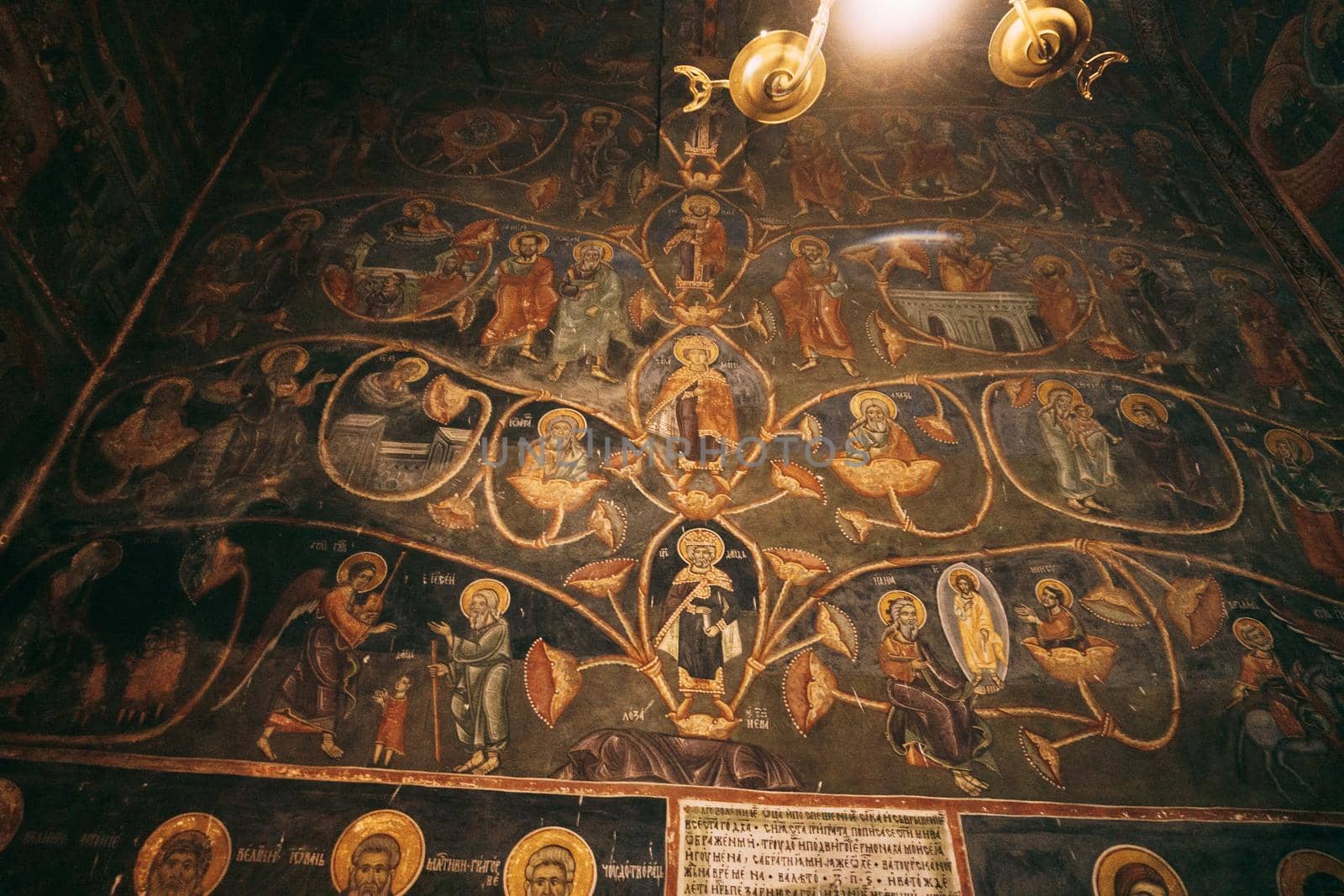 Church wall with paintings from the lives of the saints. High quality photo