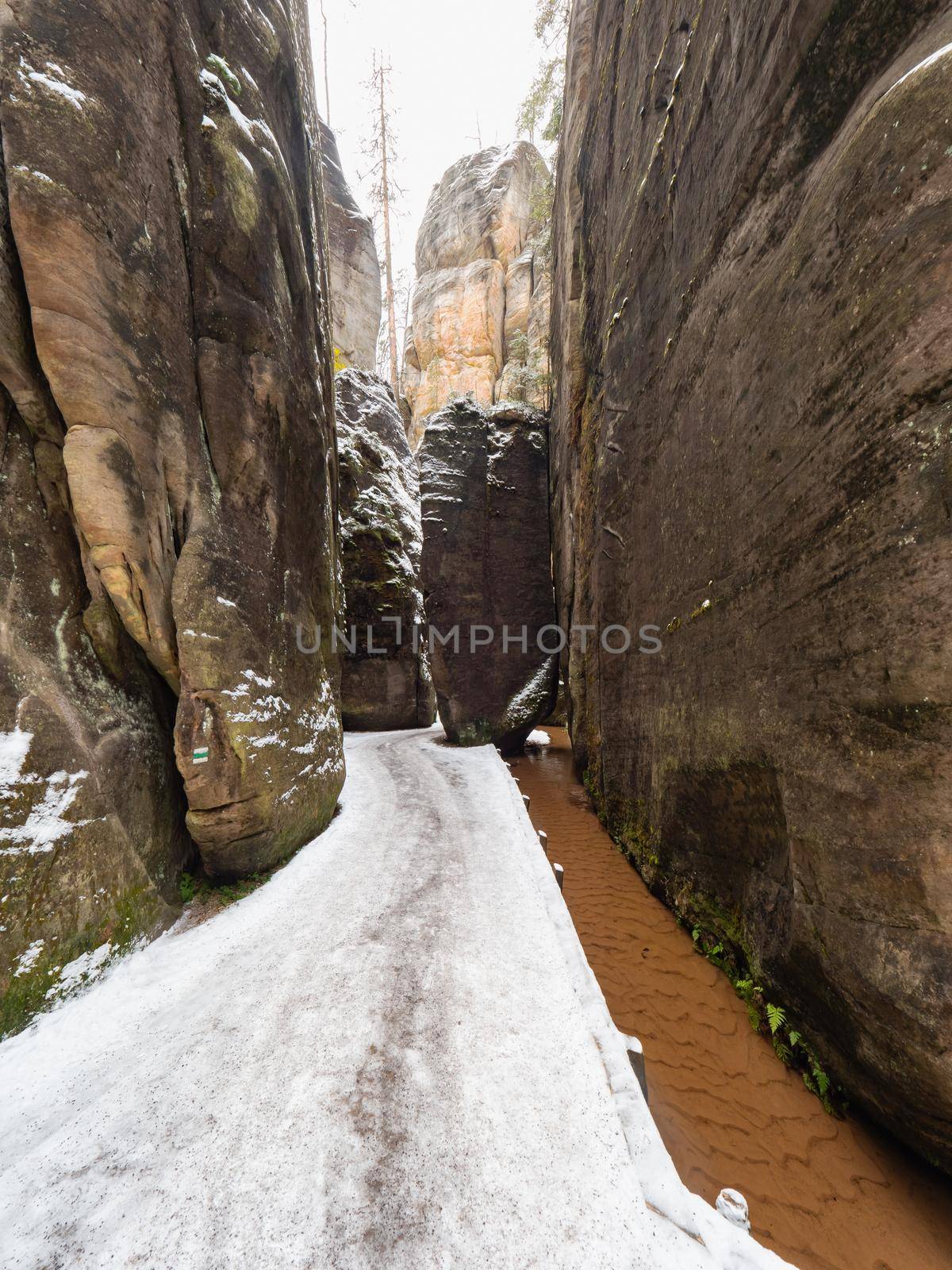 Scenic detail of path in Sandstone rocky labyrinth  in  Adrspach during winter by rdonar2