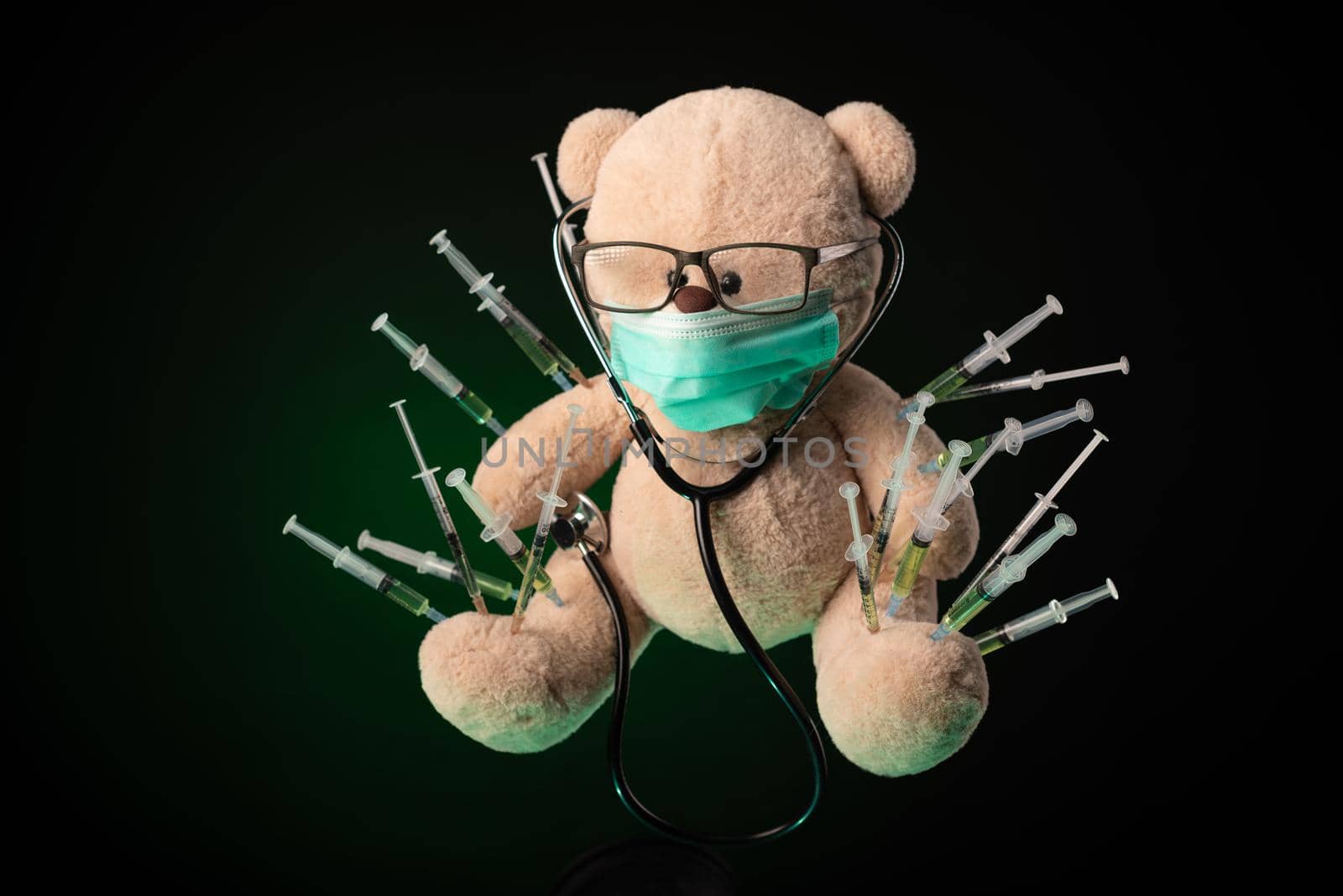 the children's vaccination against the covid19 virus and vaccinations on the example of a teddy bear