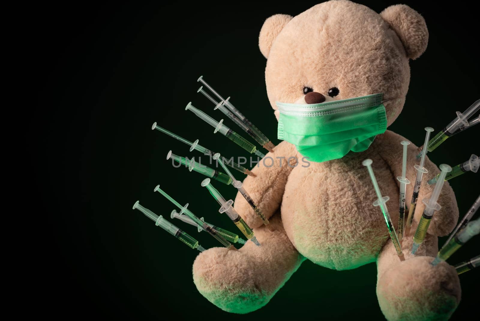 the children's vaccination against the covid19 virus and vaccinations on the example of a teddy bear