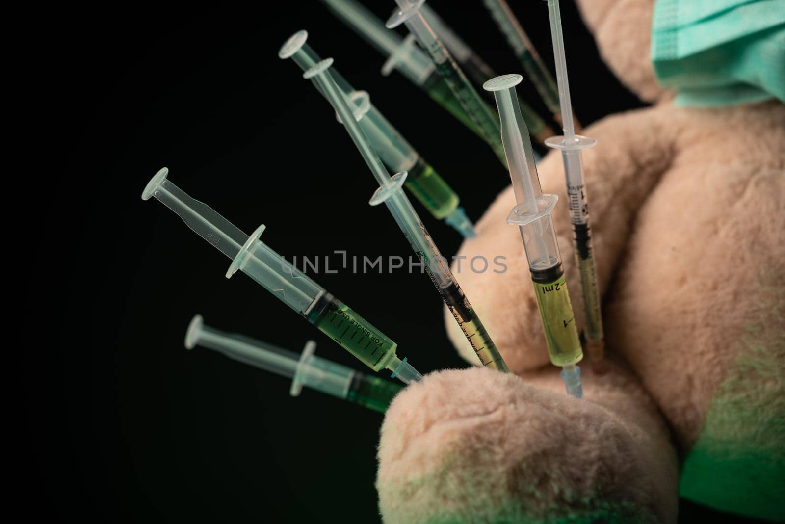 the children's vaccination against the covid19 virus and vaccinations on the example of a teddy bear