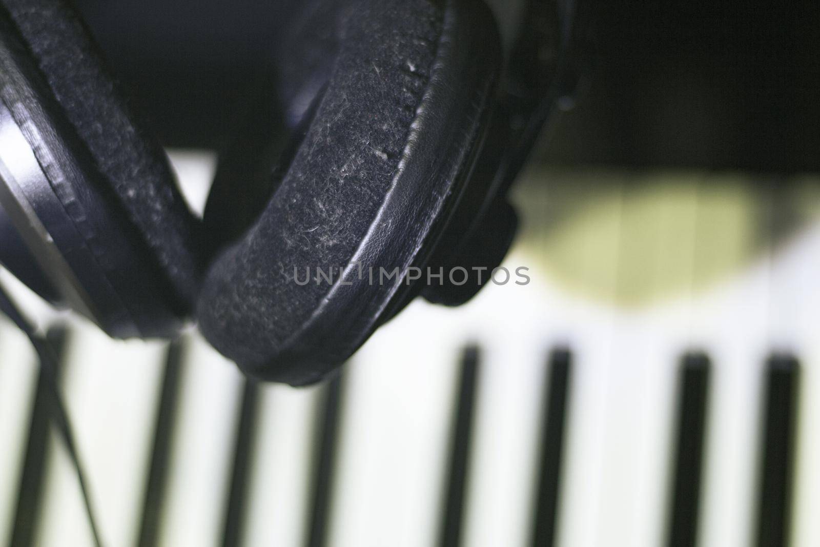Music headphones on piano keys by GemaIbarra