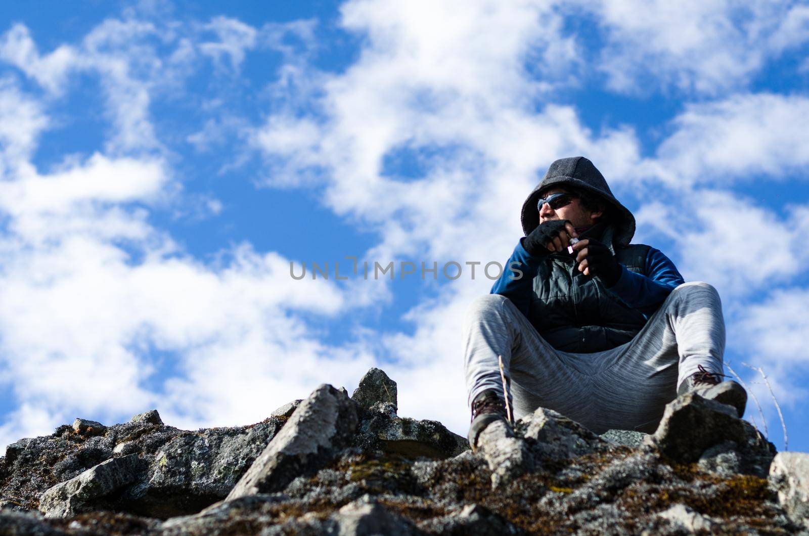 Successful hiker man enjoys the view on top of the mountain in Chiprac - Lima - Peru