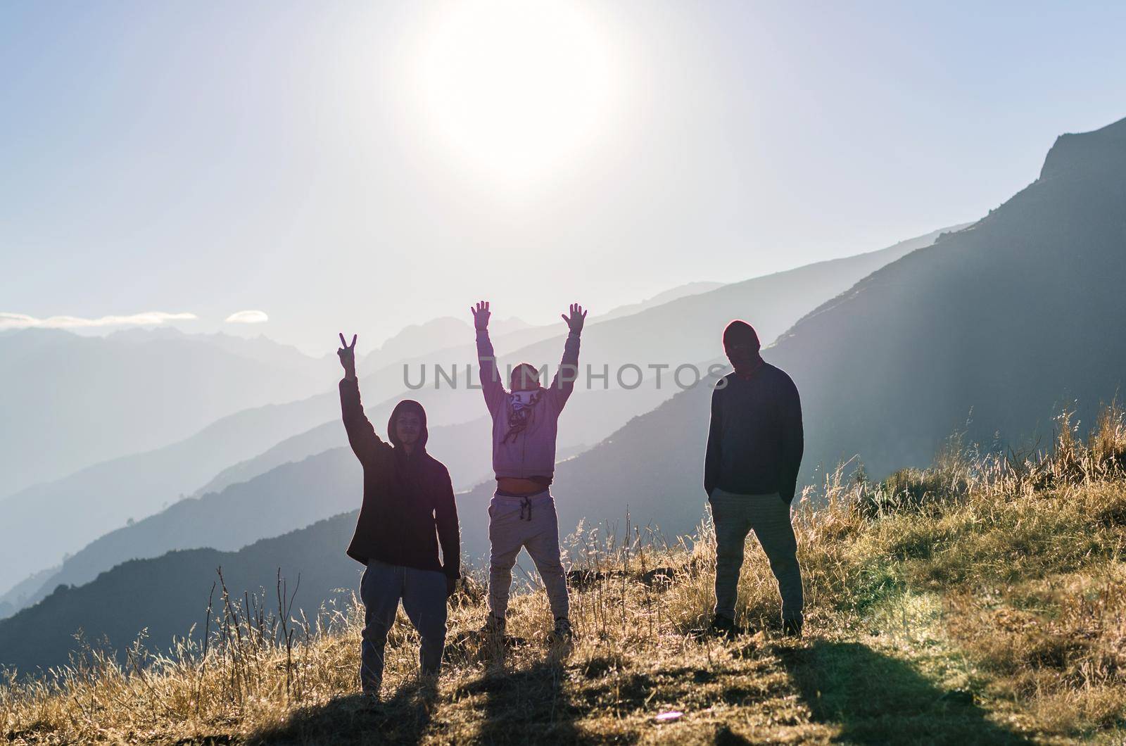 Three happy friends are looking on mountains and having fun together. Space for text. Travel concept. Archaeological zone of Chiprac - north of Lima - Peru