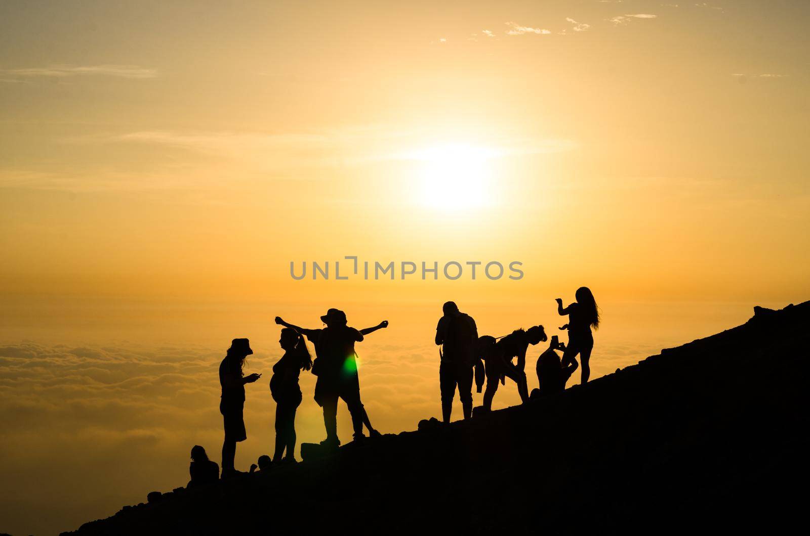 Beautiful sunset view from Apu Siqay with the silhouette of unrecognizable people, located in Villa Maria - Lima - Peru