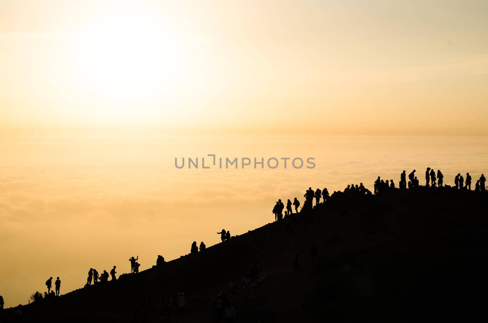 Beautiful sunset view from Apu Siqay with the silhouette of unrecognizable people, located in Villa Maria - Lima - Peru