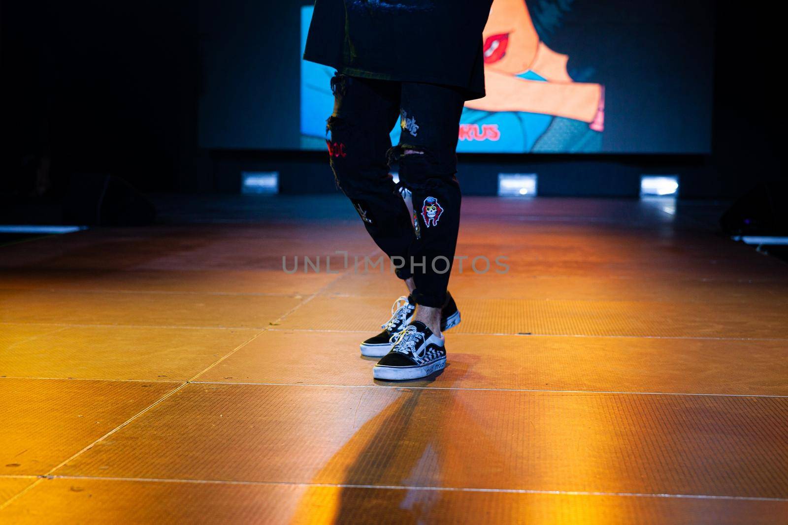 Close-up of the artist's legs during a performance . High quality photo