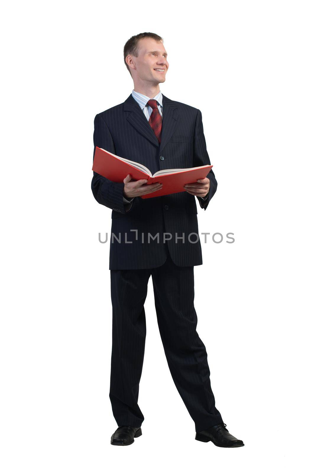 Young businessman reading book isolated on white background