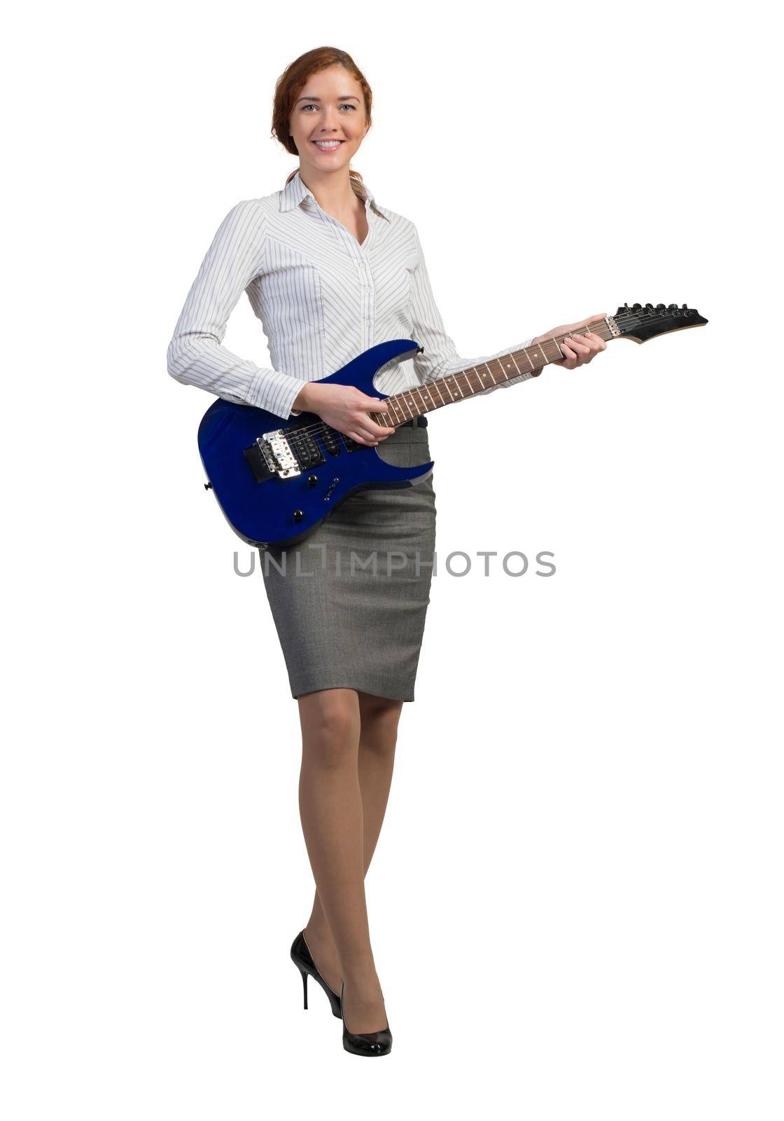 Cheerful businesswoman playing electronic guitar isolated on white background