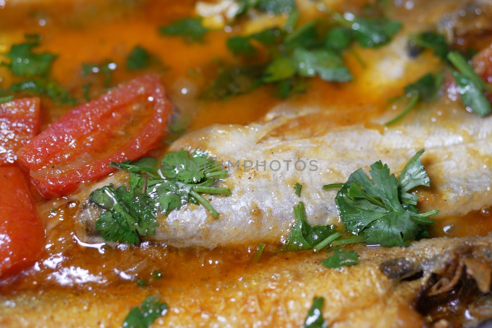 Close up of homemade indian curry fish.