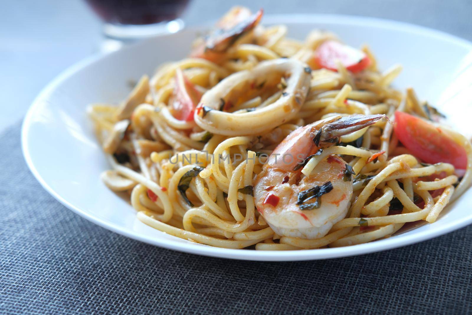 plate of sea food pasta on table .
