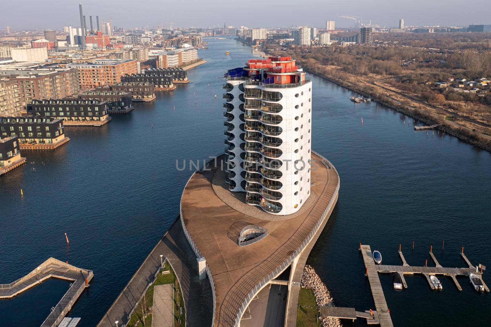 Copenhagen, Denmark - January 10, 2022: Aerial drone view of modern residential building Metropolis on Sluseholm in Sydhavn district.