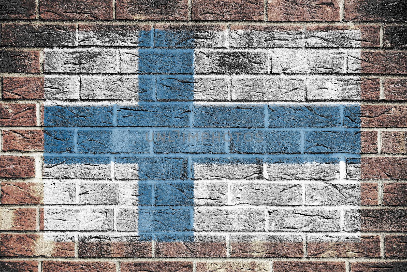 A Finland flag on old brick wall background