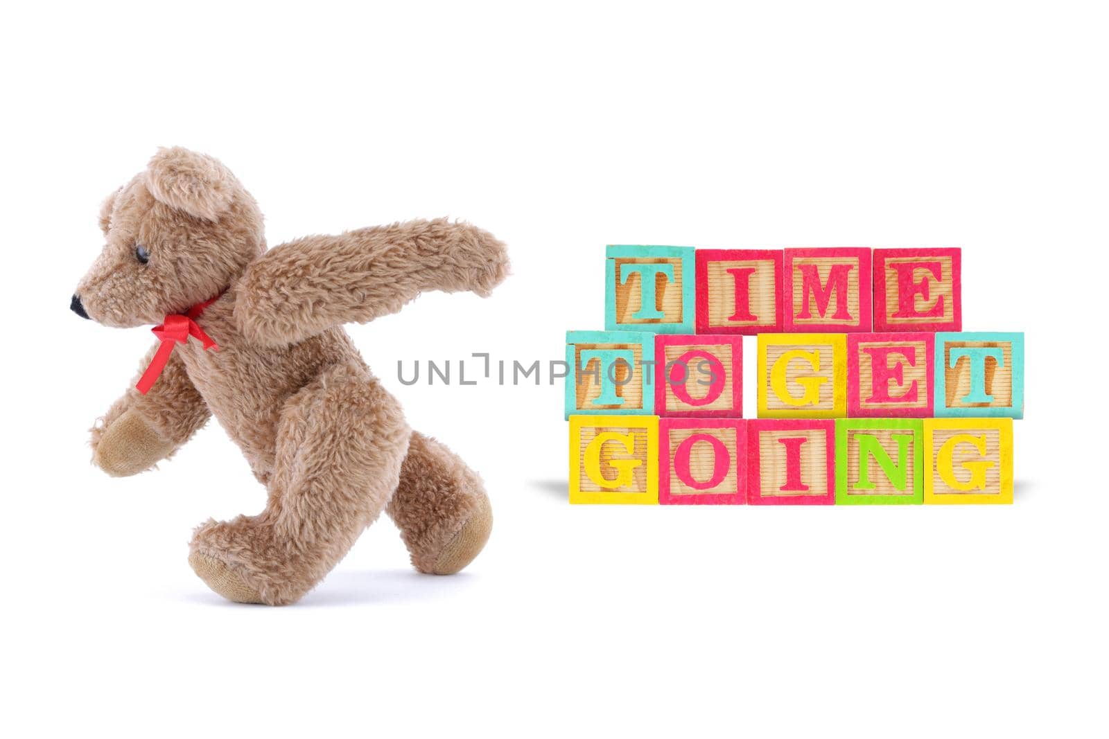 A time to get going business concept with wood blocks and teddy bear