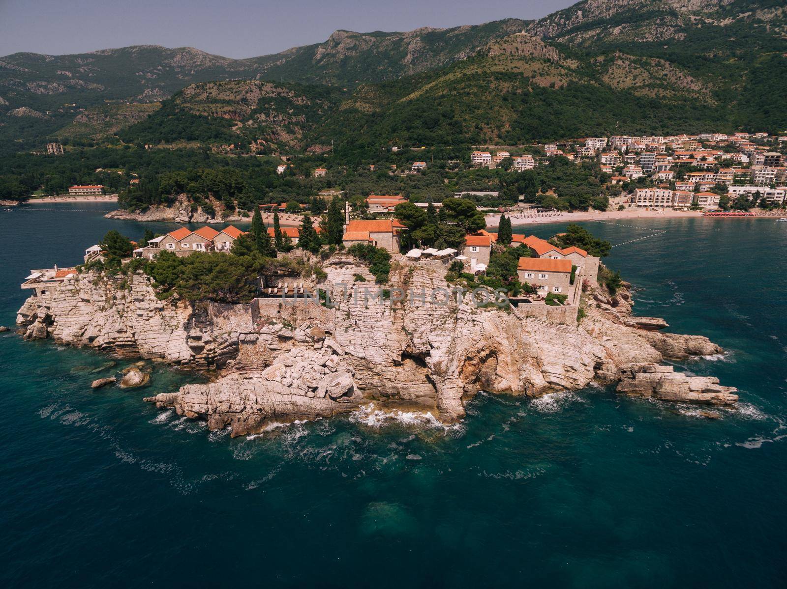 Stone cliff of Sveti Stefan island from the sea side. High quality photo