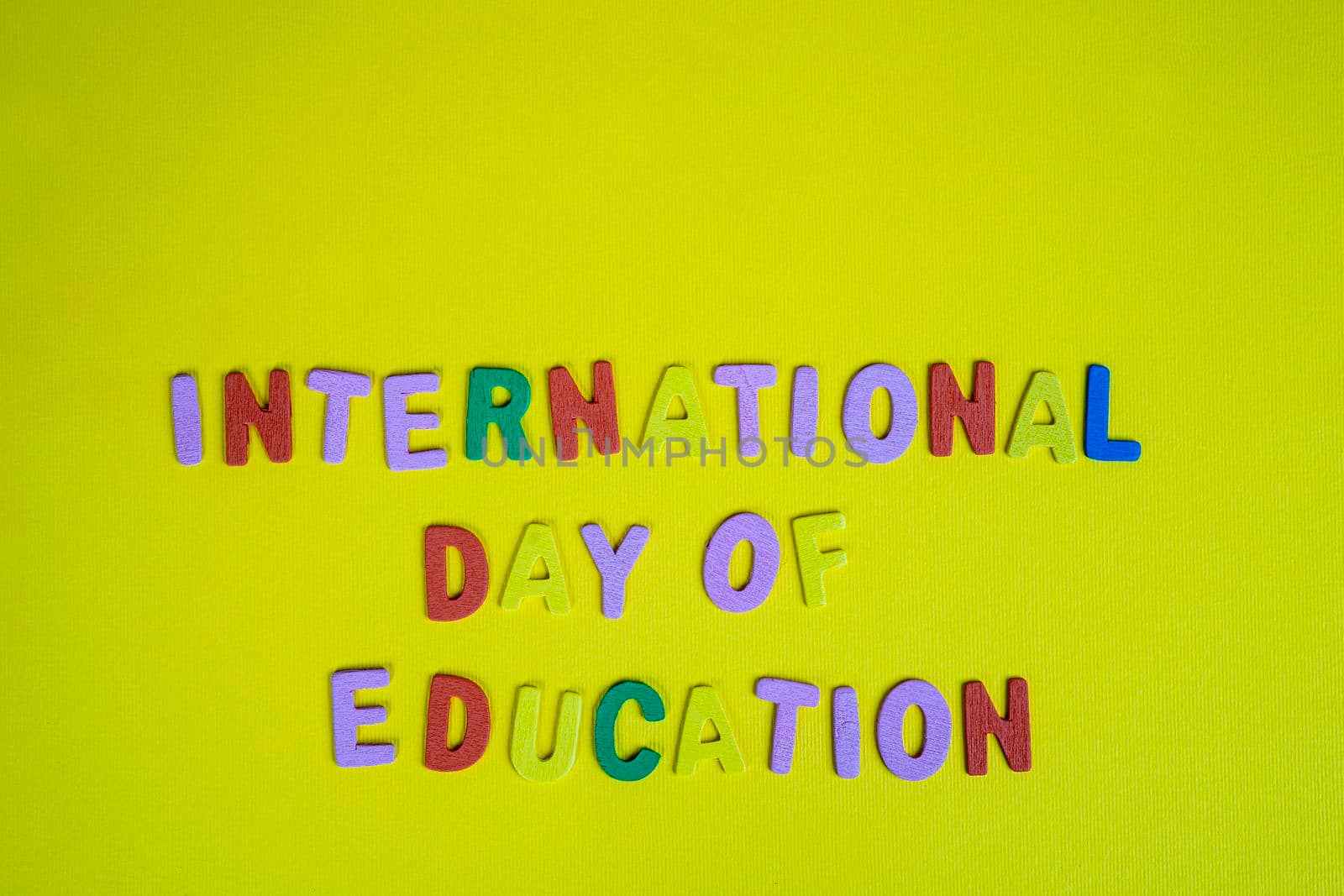 the phrase international day of education formed with colorful letters