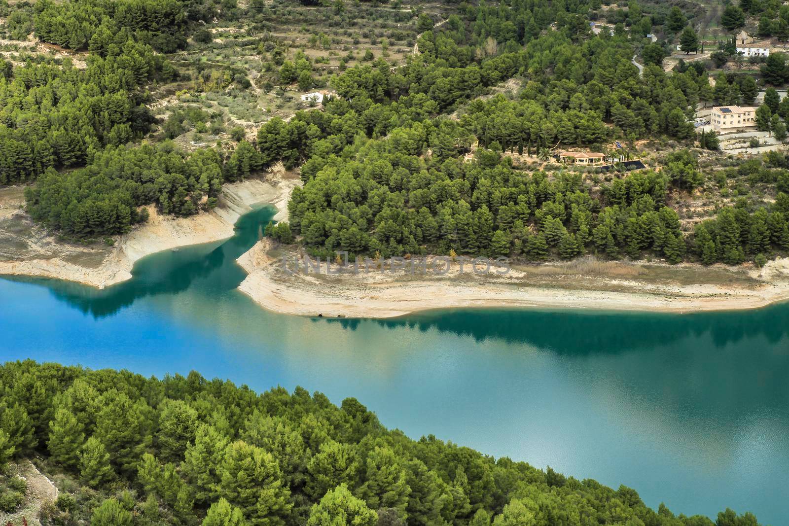 The swamp of Guadalest village surrounded by vegetation and mountains on a sunny day