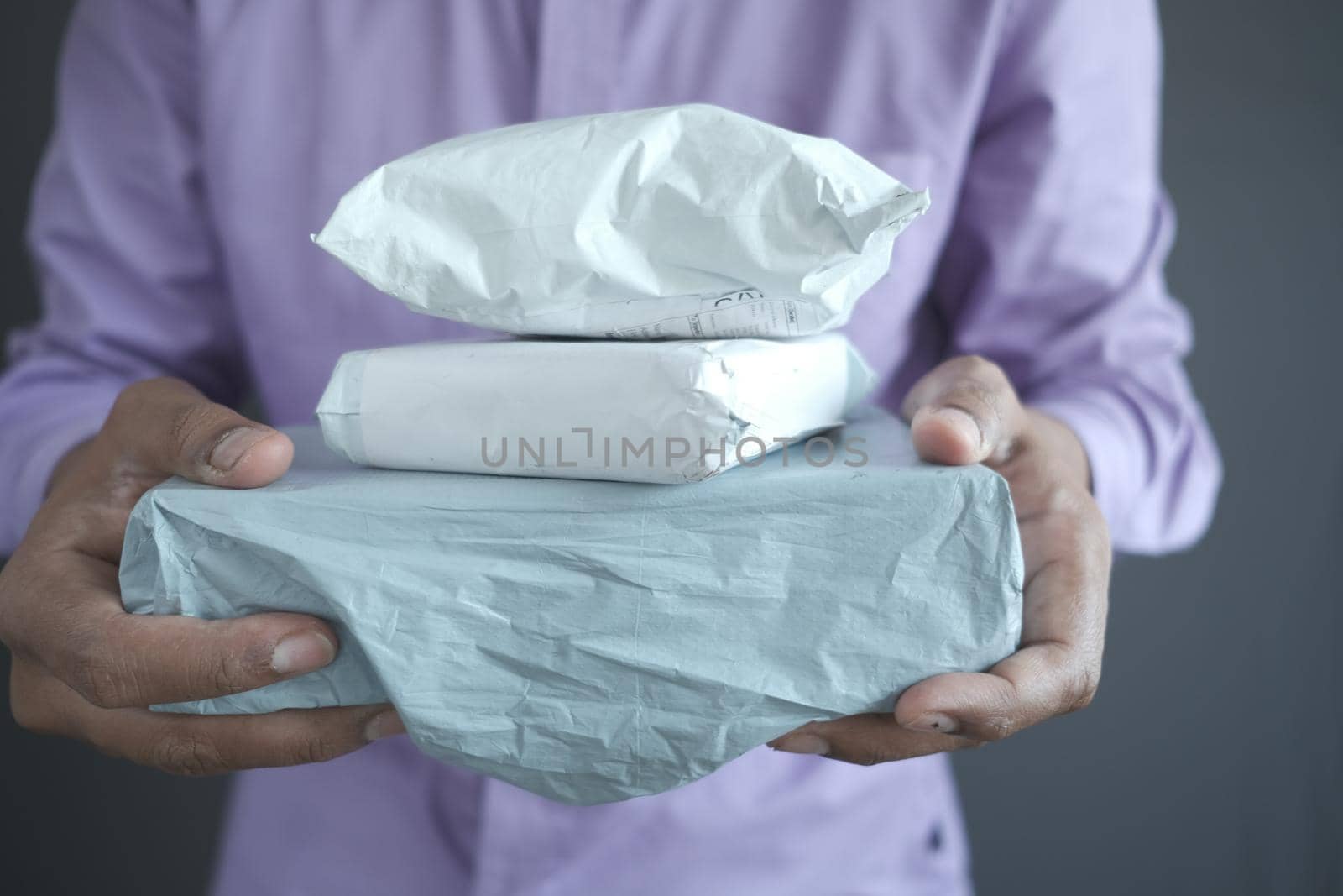 men holding delivery package close up .