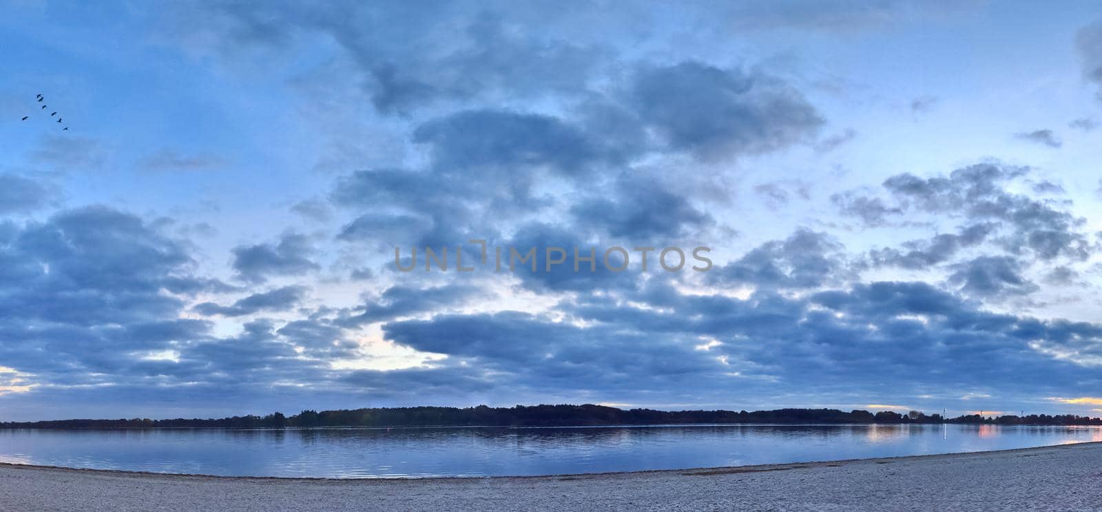 Beautiful high resolution panorama of a lake with a stunning sky