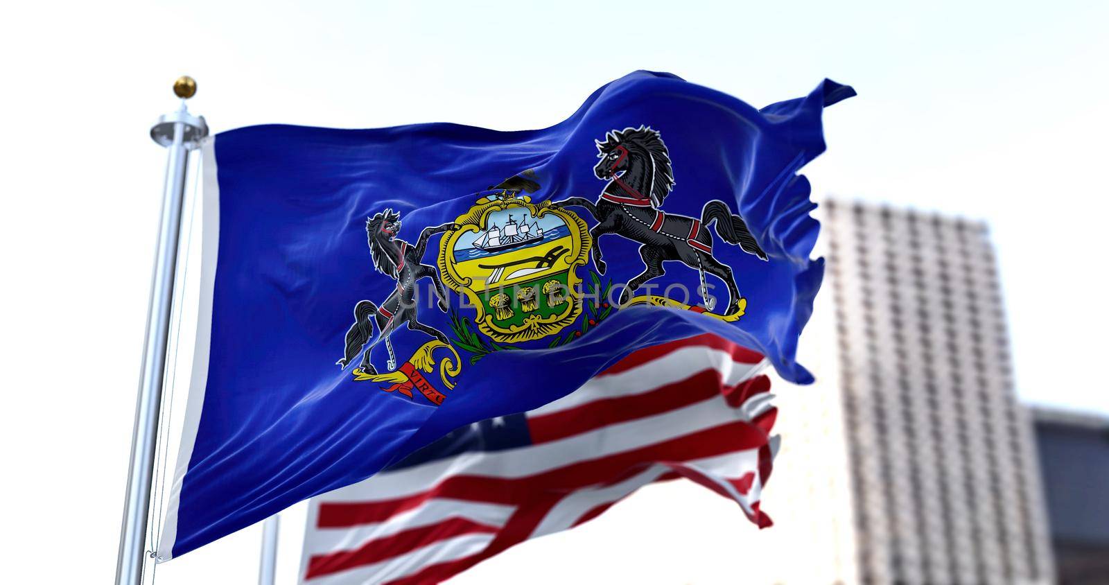 the flag of the US state of Pennsylvania waving in the wind with the American flag blurred in the background. Pennsylvania was admitted to the Union on December 12, 1787 as 2nd state