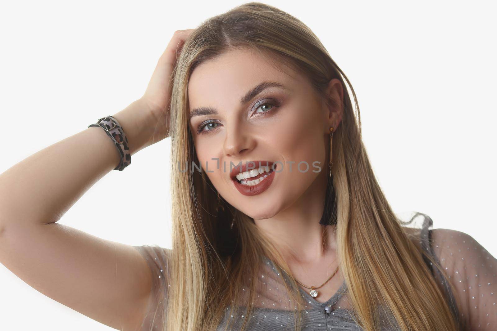 Portrait of beautiful stylish young blonde woman posing on white background in studio. Professional model work for model agency. Modeling, beauty concept