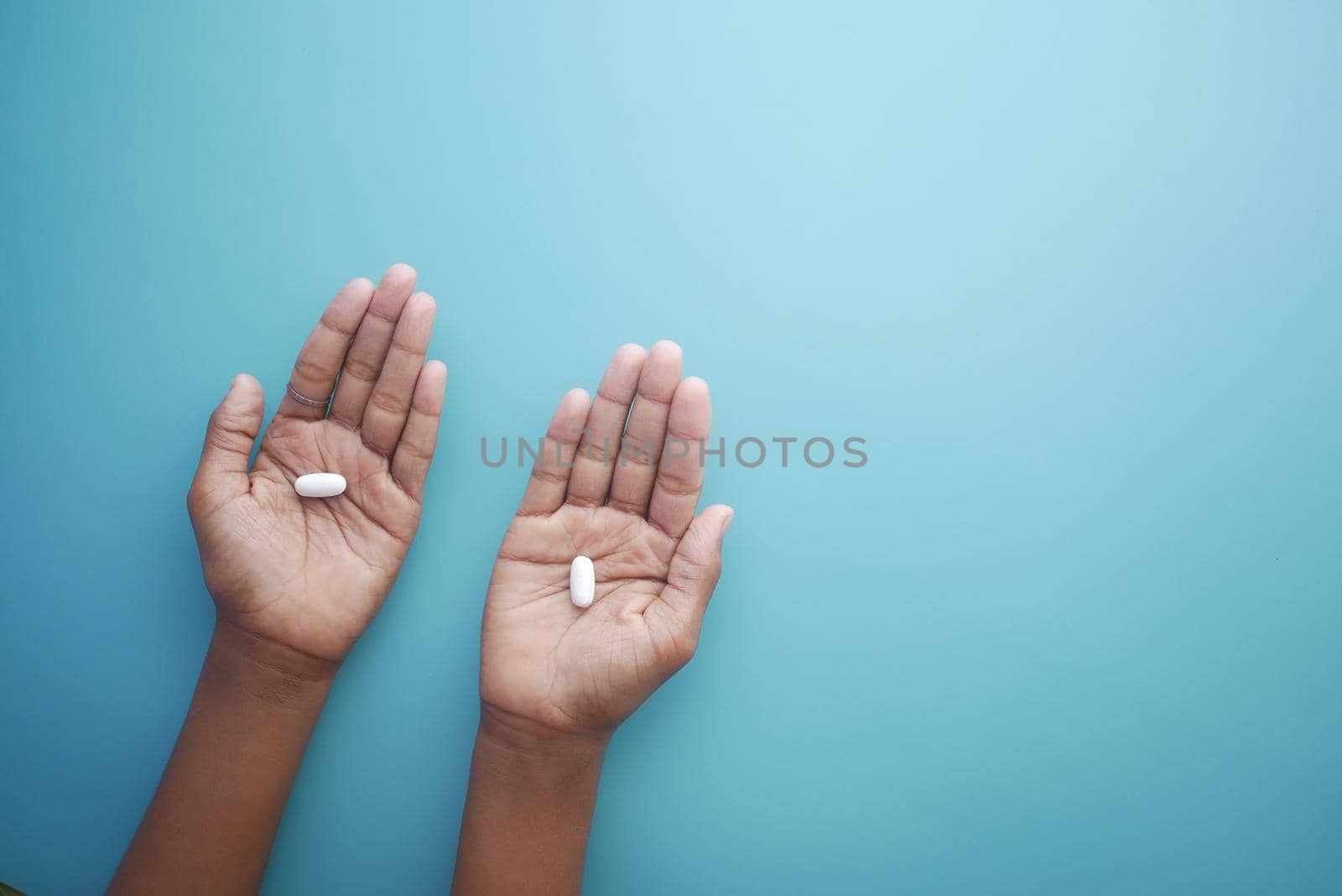 close up of medical pills on palm of child hand ,