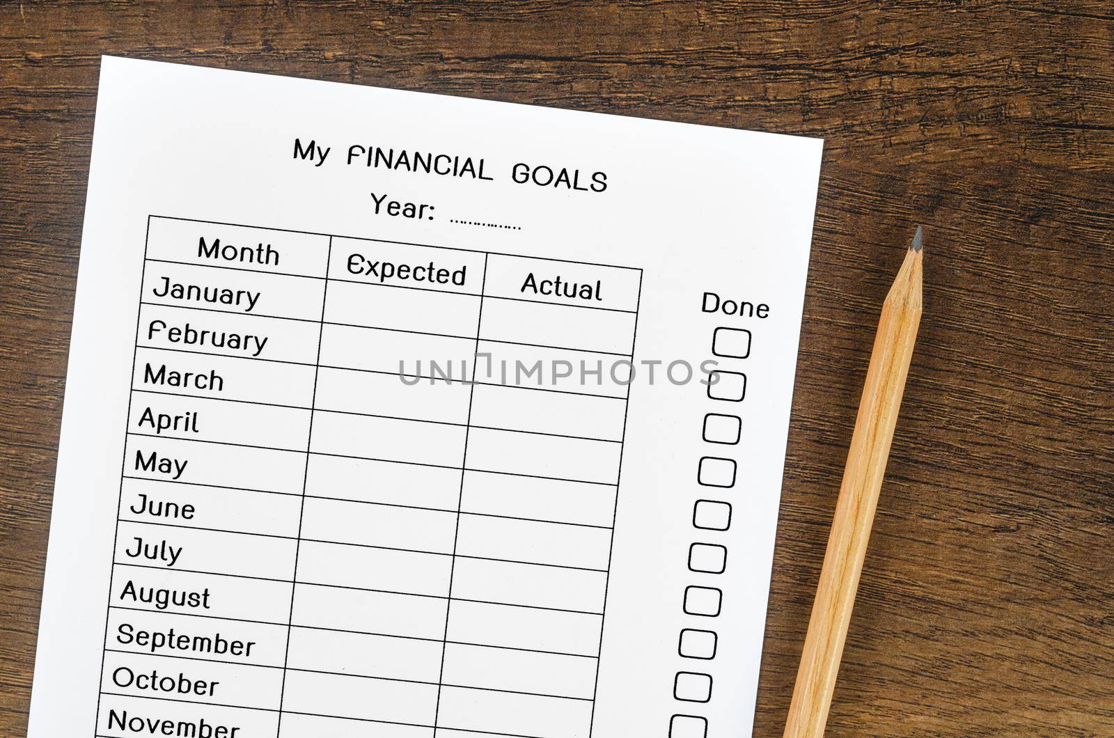 My planning financial goals form and wooden pencil.