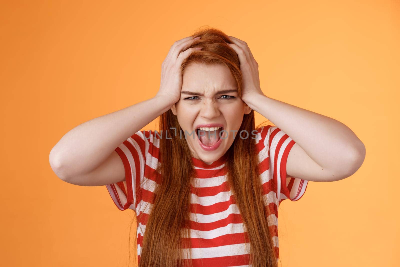 Pissed fed up redhead female teenager annoyed, break down, grab head yelling hateful displeased, depressed, upset failure, stand angry disappointed, panic, shouting aggressive orange background by Benzoix