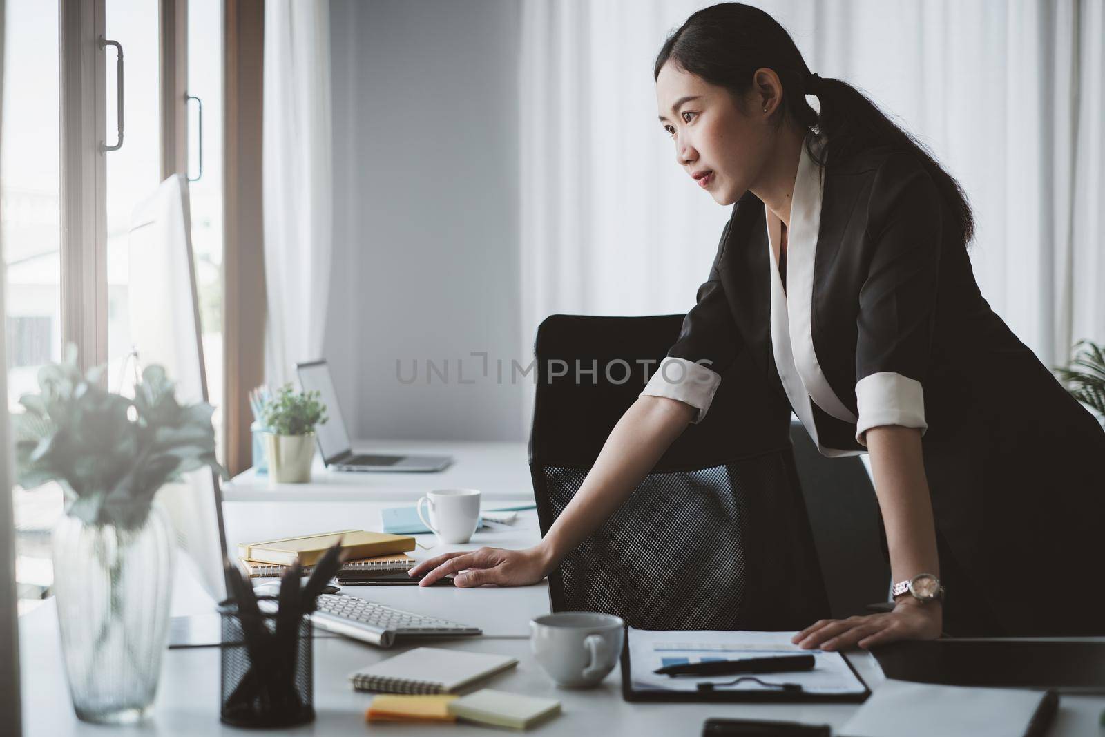 Asian business woman using computer desktop talk to colleagues for briefing business plan in video call. finance fund investment concept