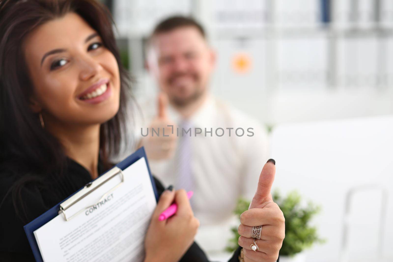 Female hand showing thumbs up OK gesture at meeting. Ideal solution for mediation concept