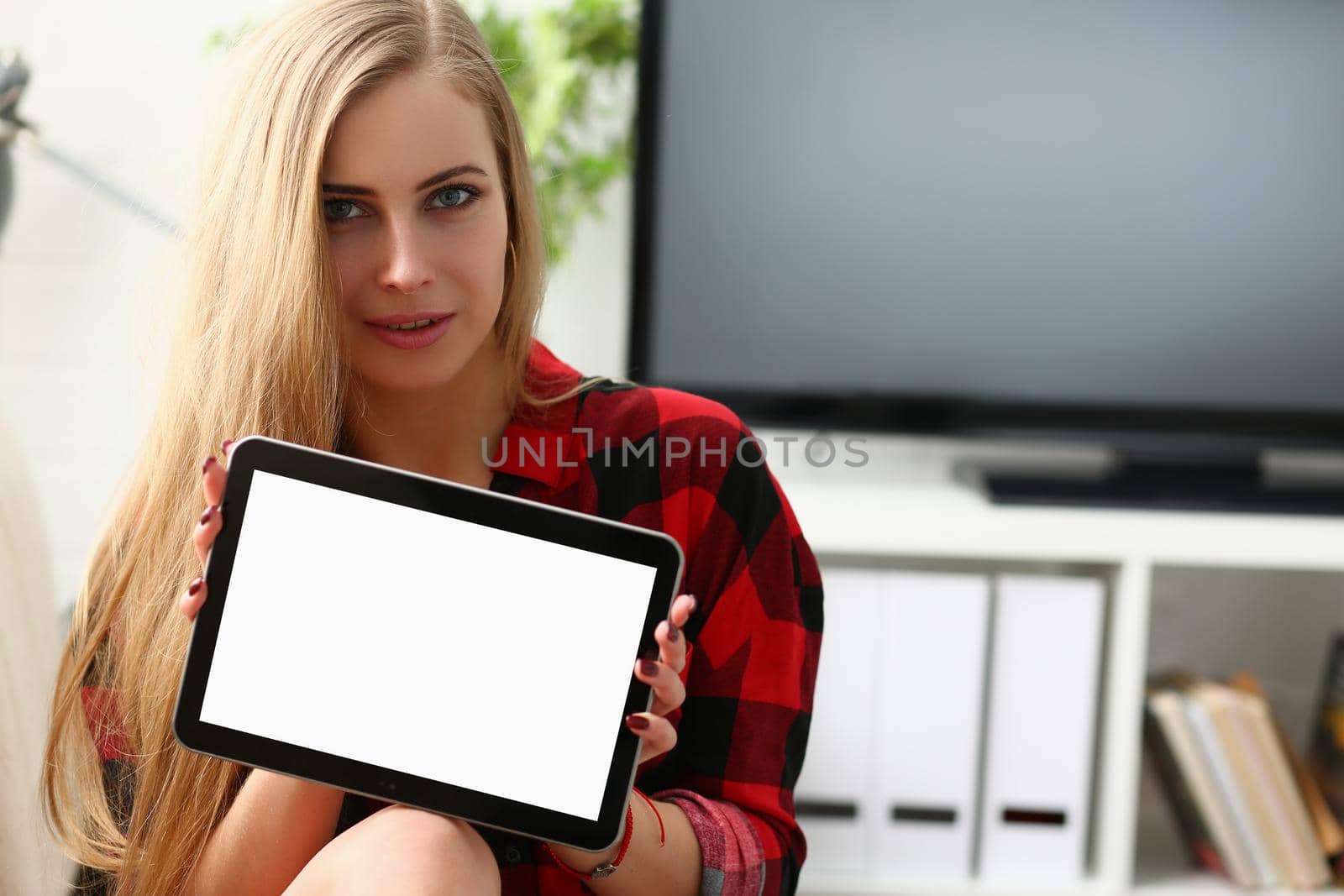 Young beautiful woman holding tablet. Online business app concept