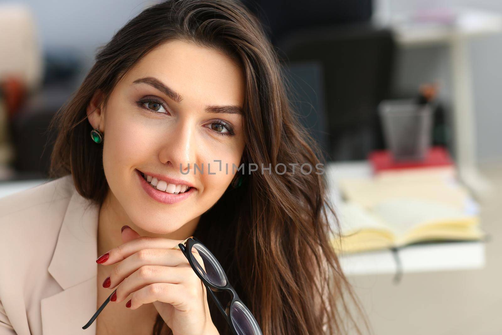 Smiling confident businesswoman at workplace looks up. Workplace worker dress code and job offer customer visit concept