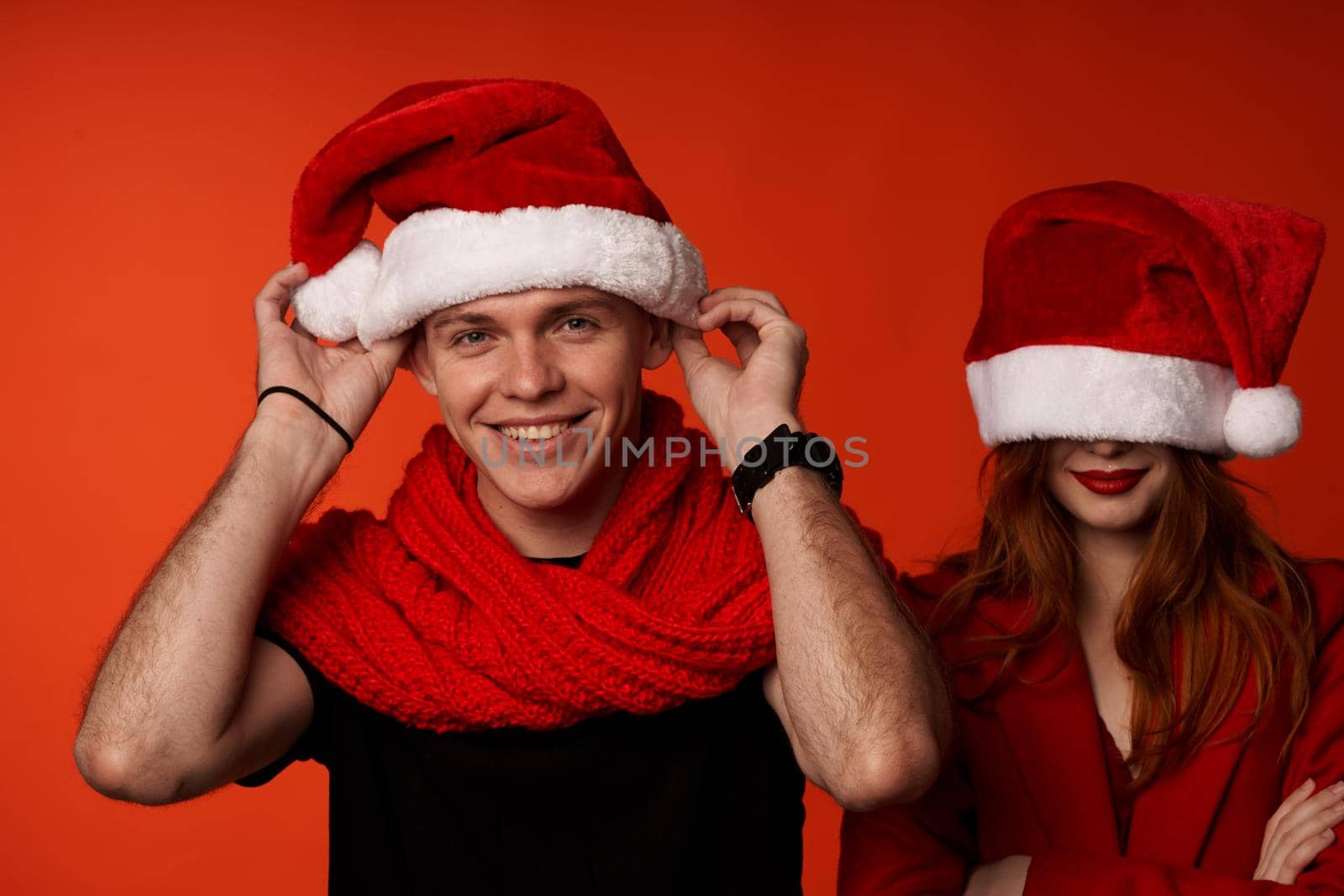 young couple in New Year's clothes Christmas holiday isolated background by SHOTPRIME