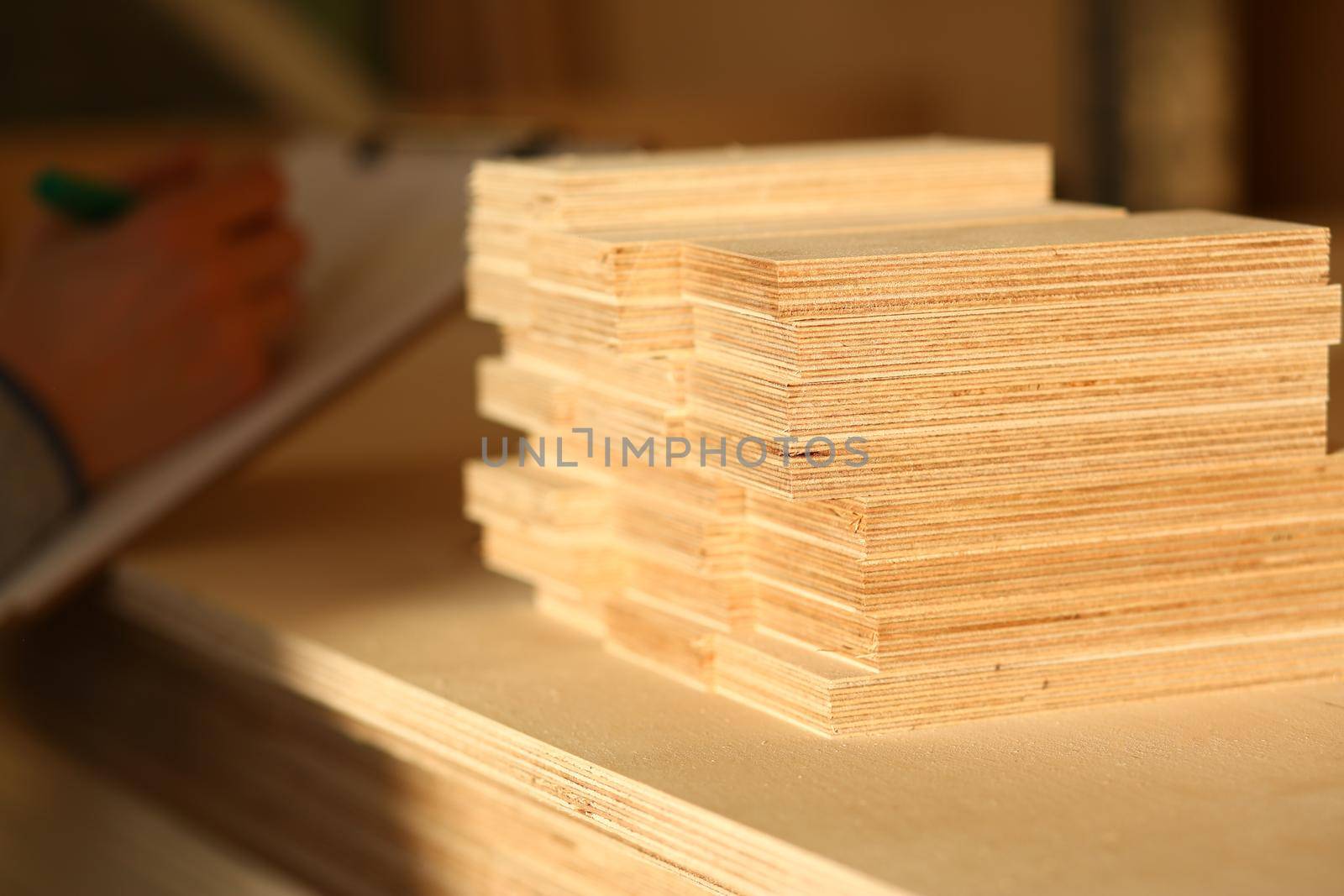 Plank board closeup. Wood plank panel for construction and production furniture. Wood chipboard cutting board warehouse