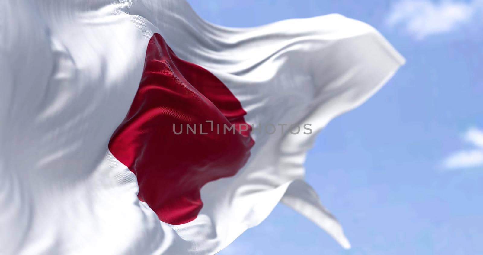 Detailed close up of the national flag of Japan waving in the wind on a clear day. Democracy and politics. Asian country. Selective focus.