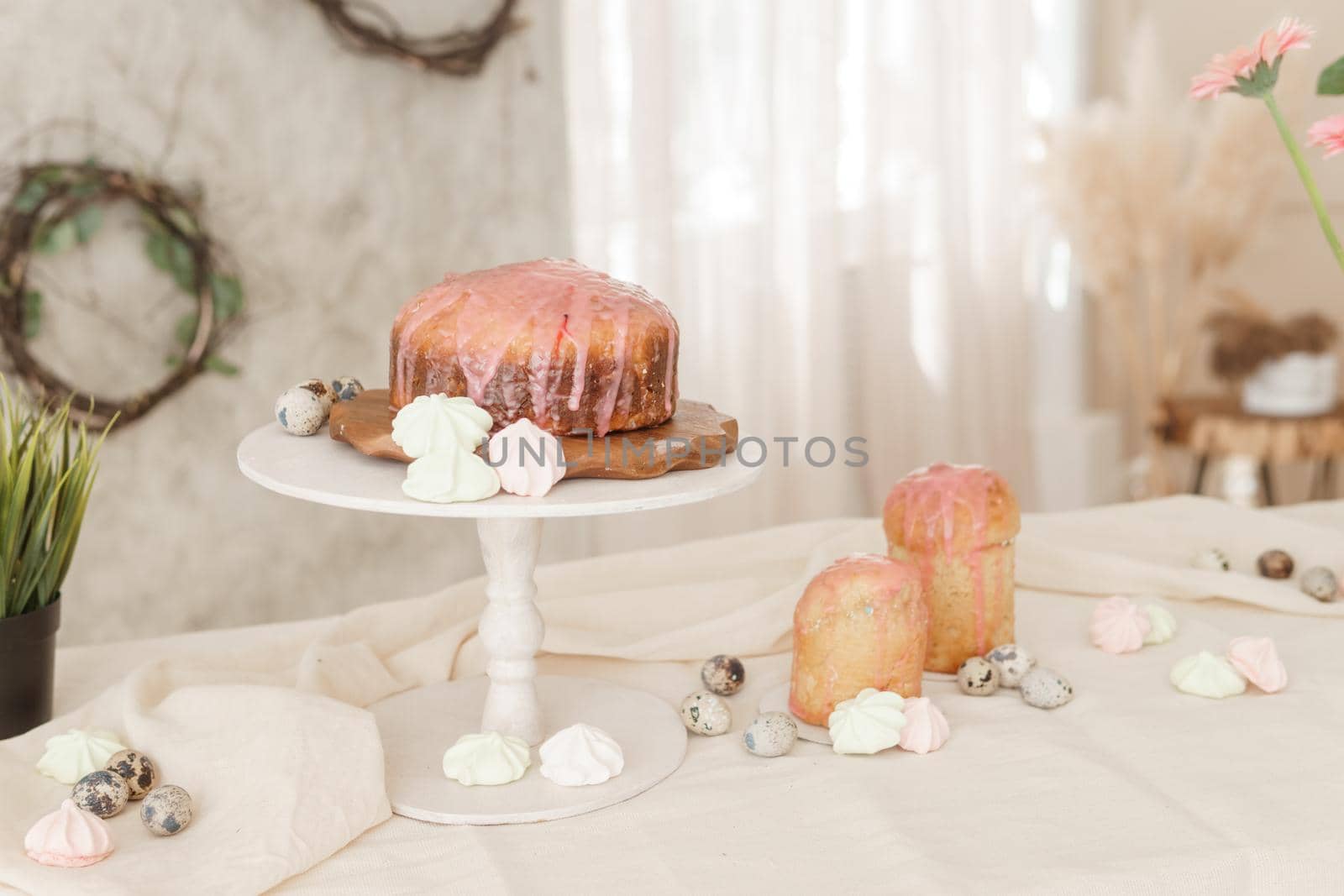 A set table for the celebration of Easter. Cakes and quail eggs on the Easter table. Happy Easter.