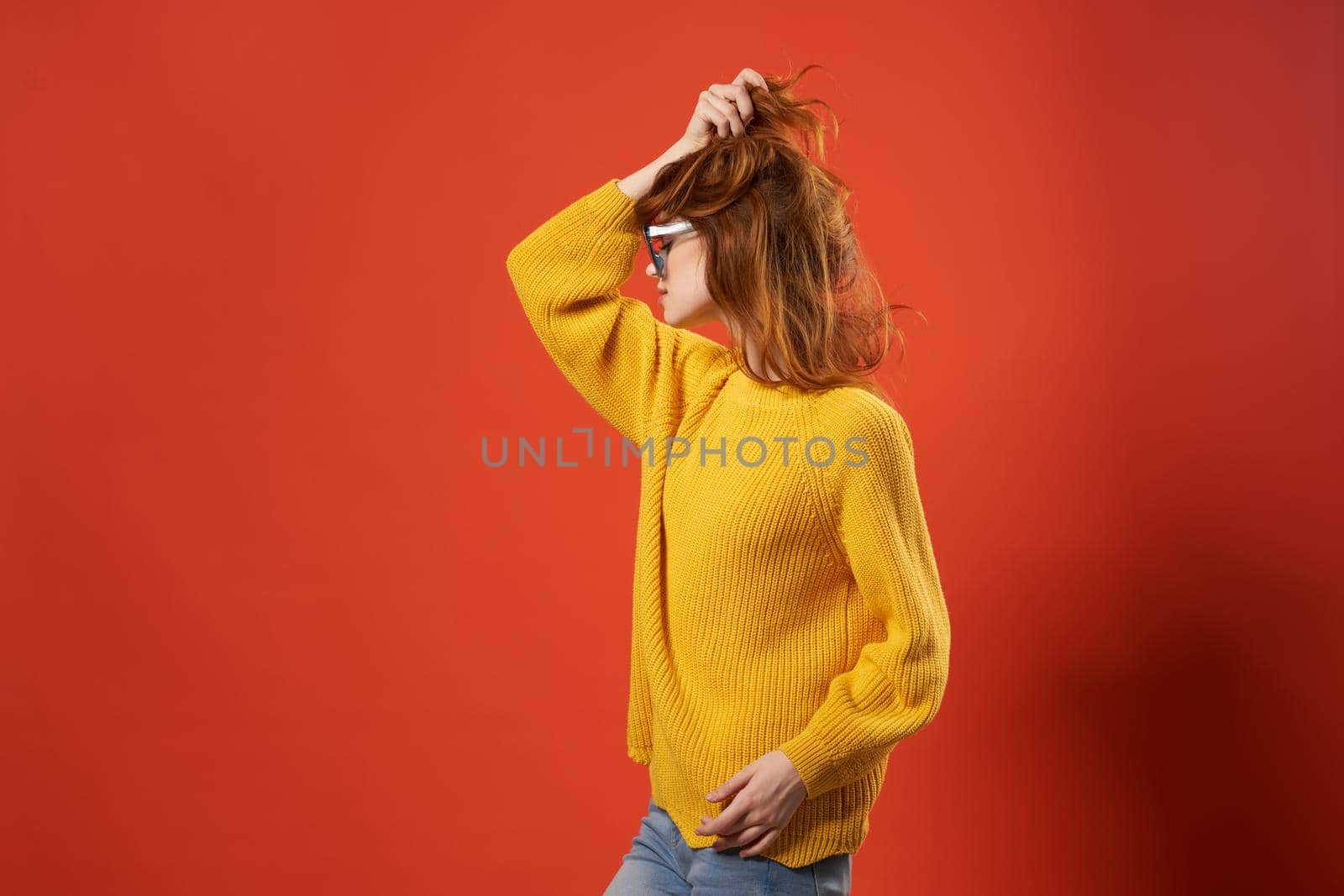 pretty woman in yellow sweater fashion glasses red background by SHOTPRIME