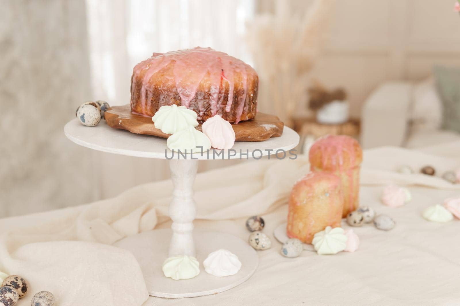 A set table for the celebration of Easter. Cakes and quail eggs on the Easter table. Happy Easter.
