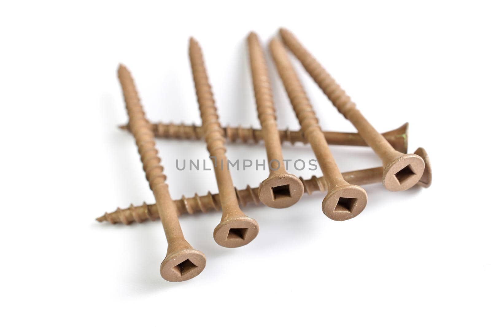 Brown Deck Screws Isolated on a White Background by markvandam