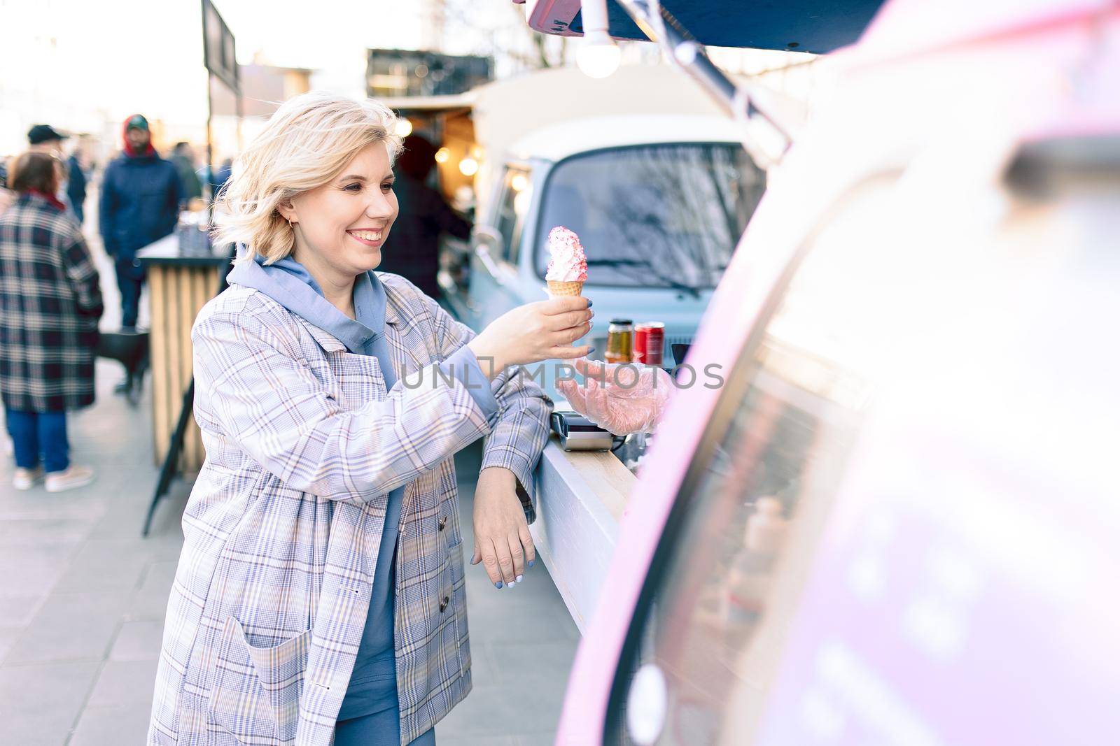 Super happiness girl holding ice cream in the right hand. High quality photo